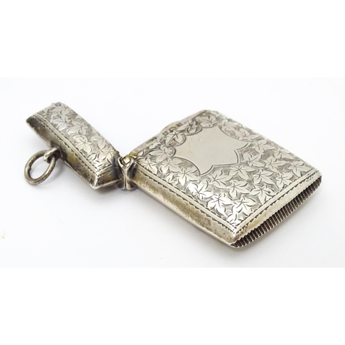 267 - A silver vesta case with engraved foliate detail. Hallmarked Birmingham 1901 maker Minshull & Latime... 