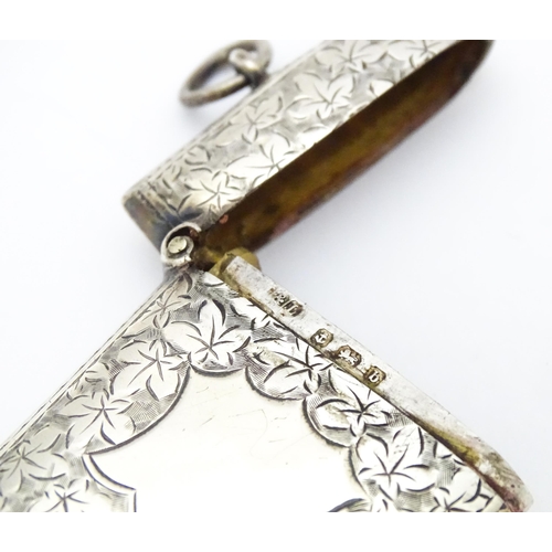 267 - A silver vesta case with engraved foliate detail. Hallmarked Birmingham 1901 maker Minshull & Latime... 