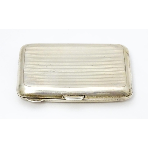 269 - A silver cigarette / cheroot case with  banded engine turned decoration Hallmarked Birmingham 1915 m... 