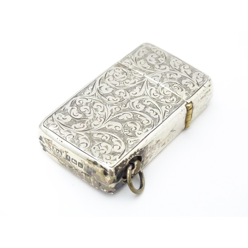 271 - An early 20thC silver lighter with engraved acanthus scroll decoration hallmarked Birmingham 1909 ma... 