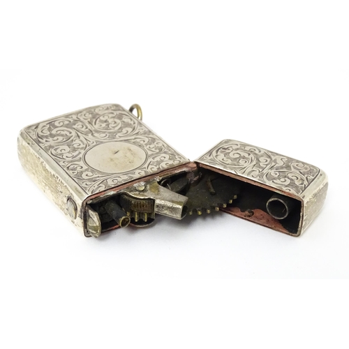 271 - An early 20thC silver lighter with engraved acanthus scroll decoration hallmarked Birmingham 1909 ma... 