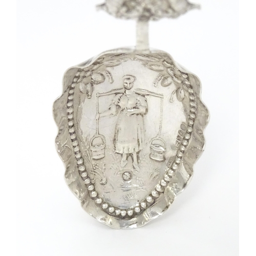 275 - A Dutch silver caddy spoon with embossed decoration. Approx. 4 3/4