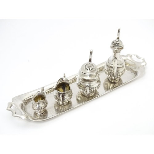 281 - A silver 5 piece miniature / dolls house tea set comprising tea pot, coffee pot, sugar bowl and crea... 