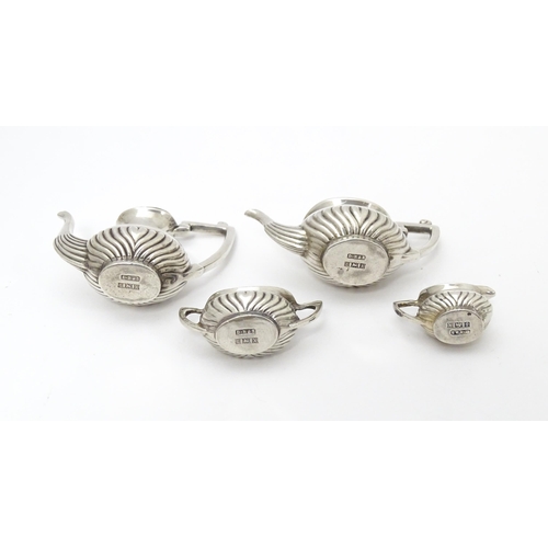 281 - A silver 5 piece miniature / dolls house tea set comprising tea pot, coffee pot, sugar bowl and crea... 