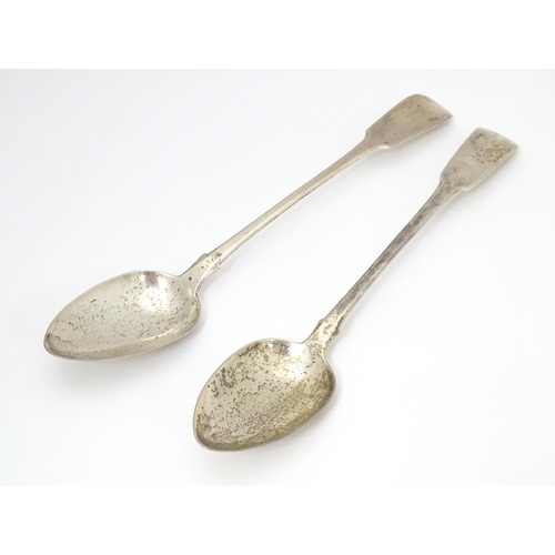 286 - Two silver fiddle pattern serving / basting spoons one hallmarked London 1817 the other London 1820.... 