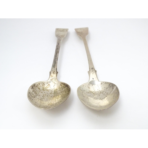 286 - Two silver fiddle pattern serving / basting spoons one hallmarked London 1817 the other London 1820.... 