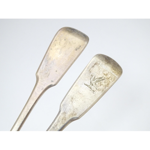 286 - Two silver fiddle pattern serving / basting spoons one hallmarked London 1817 the other London 1820.... 