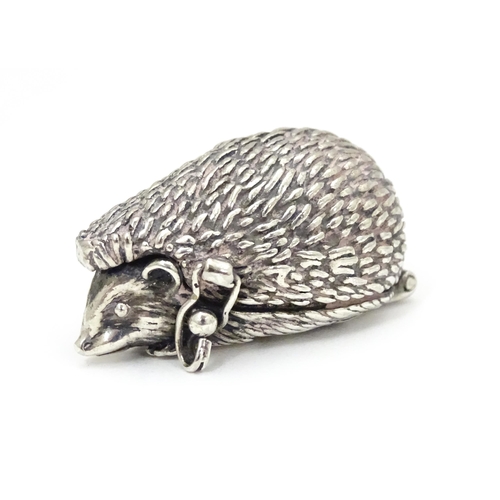 289 - A white metal novelty pill box modelled as a hedgehog. Approx. 1 1/2