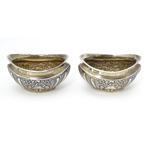 292 - A pair of silver salts with embossed decoration. hallmarked Birmingham 1904 maker Joseph Gloster Ltd... 