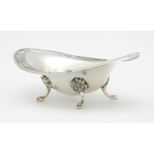 296 - A Victorian Scottish silver bon bon dish of ovoid form with pierced detail and raised on four feet. ... 