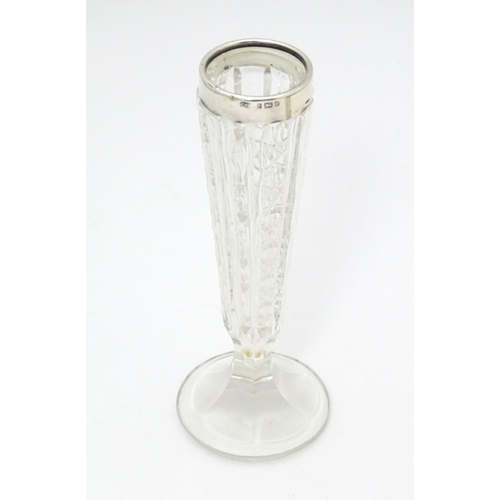 302 - A cut glass bud vase with silver rim hallmarked Birmingham 1901 together with a cut glass noggin wit... 