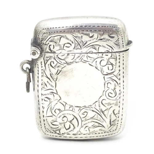 310 - A silver vesta case with engraved decoration, hallmarked Birmingham 1921, maker William Henry Sparro... 