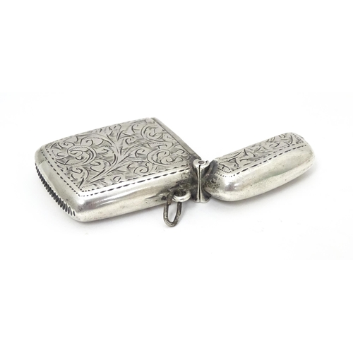 310 - A silver vesta case with engraved decoration, hallmarked Birmingham 1921, maker William Henry Sparro... 