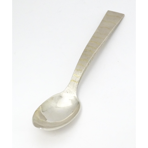 312 - A Queen Elizabeth II Scottish silver serving spoon with textured and gilt detail to handle, hallmark... 