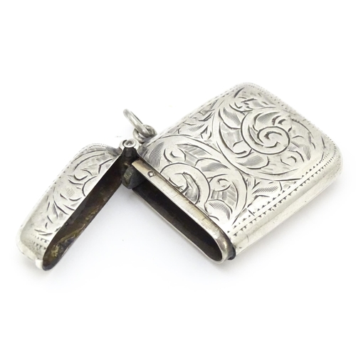 316 - A silver vesta case with engraved decoration, hallmarked Birmingham 1918, maker Joseph Gloster Ltd. ... 