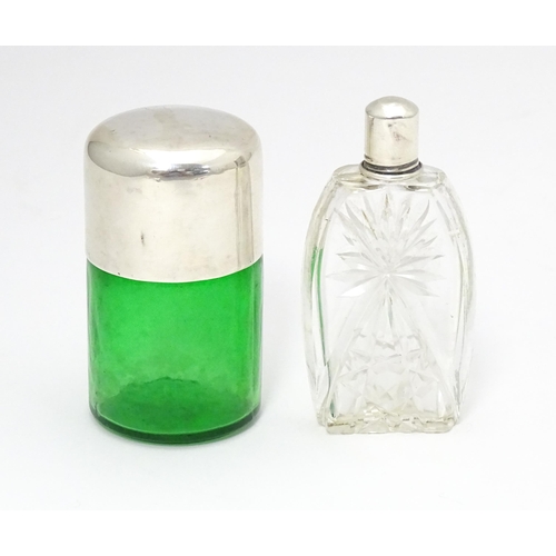 319 - A green glass salts bottle with silver lid hallmarked Birmingham 1904 maker Hillard & Thomason. Toge... 