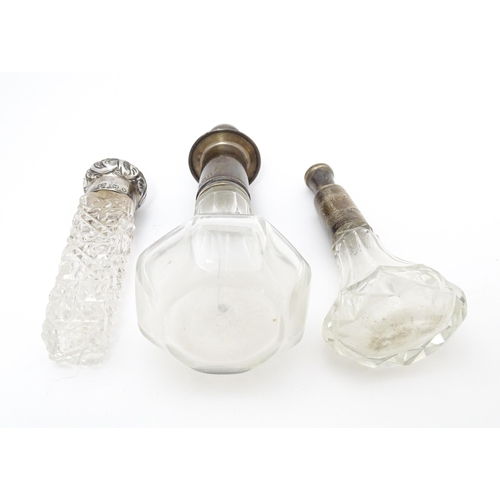 346 - A Victorian cut glass scent / salts bottle with embossed silver top hallmarked Birmingham 1896, make... 