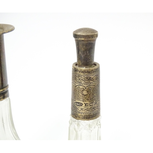 346 - A Victorian cut glass scent / salts bottle with embossed silver top hallmarked Birmingham 1896, make... 