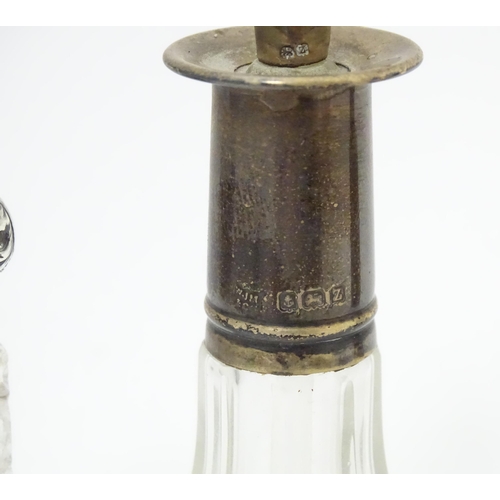 346 - A Victorian cut glass scent / salts bottle with embossed silver top hallmarked Birmingham 1896, make... 