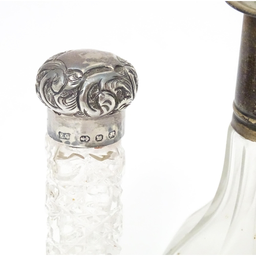 346 - A Victorian cut glass scent / salts bottle with embossed silver top hallmarked Birmingham 1896, make... 