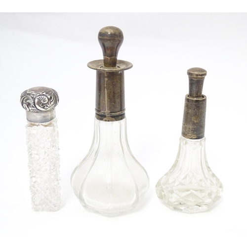 346 - A Victorian cut glass scent / salts bottle with embossed silver top hallmarked Birmingham 1896, make... 