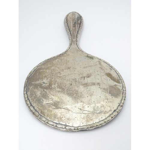 349 - A silver hand mirror and together with a silver topped glass dressing table pot. 2 1/2