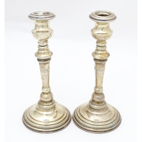 354 - A pair of .925 silver candlesticks. Approx 8