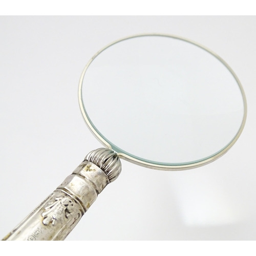 358 - A silver handled magnifying glass.  Approx. 6 1/4