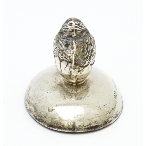 363 - A silver paperweight of ovoid form surmounted by model of a chick. Hallmarked Chester 1909 maker Sam... 