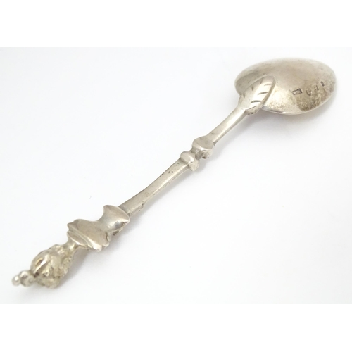 365 - A Victorian Scottish silver spoon, the handle surmounted by a figurehead. Hallmarked Edinburgh 1893 ... 