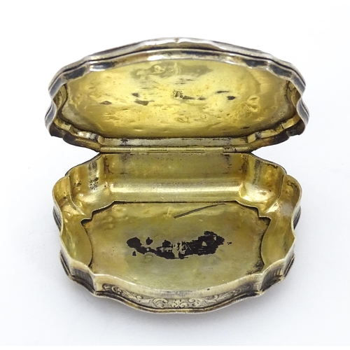 366 - A Continental silver gilt snuff box of shaped form with panels of mother of pearl, the lid decorated... 