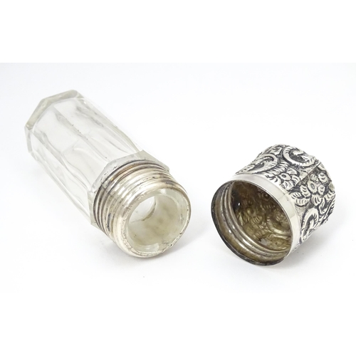 367 - A glass salts bottle with embossed silver lid, hallmarked London 1901 maker CB Approx. 3