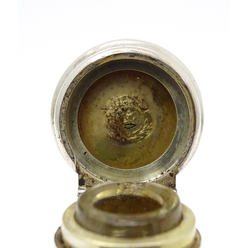 368 - A glass scent / perfume bottle with white metal lid opening to revival Crown mark titled WES. Approx... 