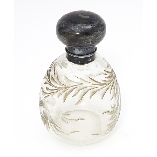 369 - A cut glass scent / perfume bottle with silver top, hallmarked London 1918 maker Charles May 4