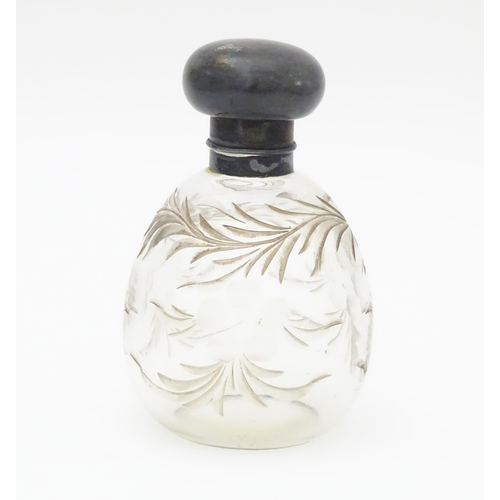 369 - A cut glass scent / perfume bottle with silver top, hallmarked London 1918 maker Charles May 4