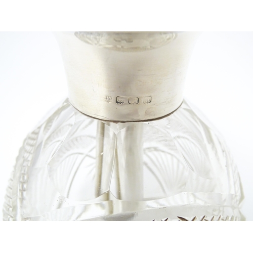 373 - A cut glass perfume / scent bottle with silver atomiser top hallmarked Birmingham 1925, maker Charle... 