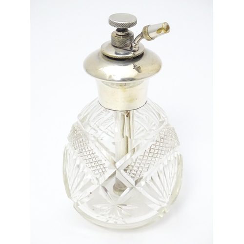 373 - A cut glass perfume / scent bottle with silver atomiser top hallmarked Birmingham 1925, maker Charle... 