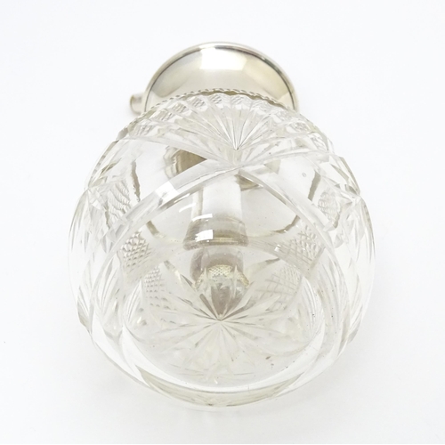 373 - A cut glass perfume / scent bottle with silver atomiser top hallmarked Birmingham 1925, maker Charle... 