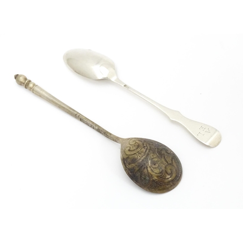 381 - A Russian silver spoon with engraved decoration to bowl. Approx 5