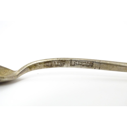 381 - A Russian silver spoon with engraved decoration to bowl. Approx 5