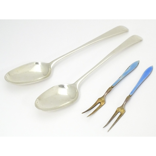 383 - Two silver spoons indistinctly marked. Together with two Scandinavian silver gilt pickle forks with ... 