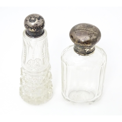 390 - A cut glass scent/ perfume bottle with silver top hallmarked Birmingham 1906 maker Levi & Salaman to... 