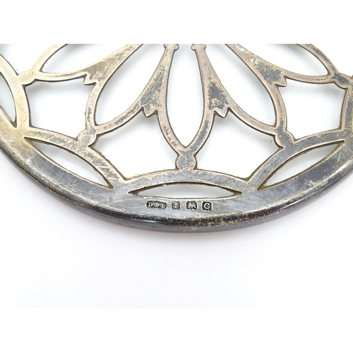 391 - A  glass coaster with silver tracery overlay hallmarked Birmingham 1927 maker Docker & Burn Ltd. App... 