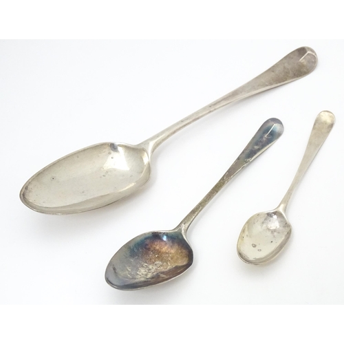 395 - Three 18thC silver tablespoons to include a fancy back shell tablespoon hallmarked London 1767, a fa... 