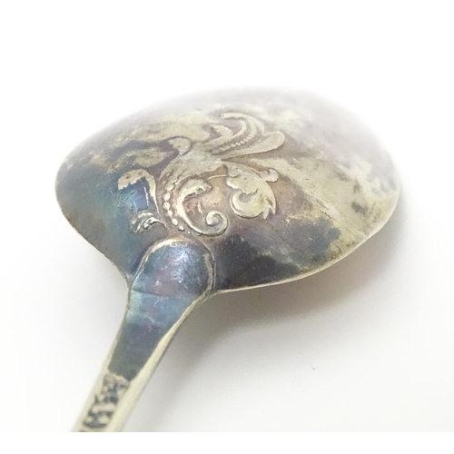 395 - Three 18thC silver tablespoons to include a fancy back shell tablespoon hallmarked London 1767, a fa... 