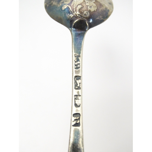 395 - Three 18thC silver tablespoons to include a fancy back shell tablespoon hallmarked London 1767, a fa... 