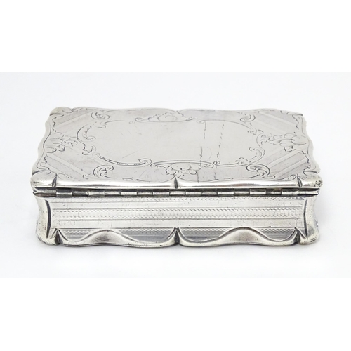 397 - A Victorian silver snuff box with engraved and engine turned decoration. Hallmarked Birmingham c.184... 