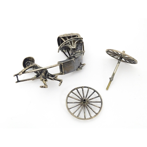 399 - A Chinese export silver model of a man pulling a rickshaw, numbered 205 and stamped with makers mark... 