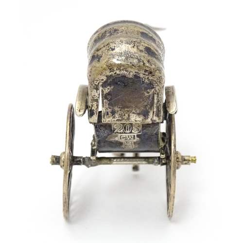 399 - A Chinese export silver model of a man pulling a rickshaw, numbered 205 and stamped with makers mark... 