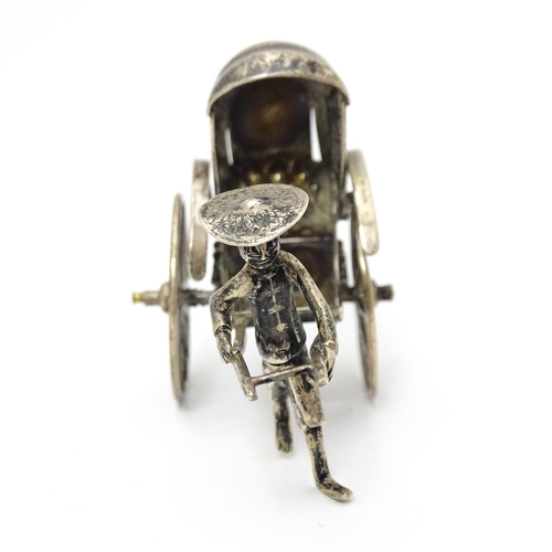 399 - A Chinese export silver model of a man pulling a rickshaw, numbered 205 and stamped with makers mark... 